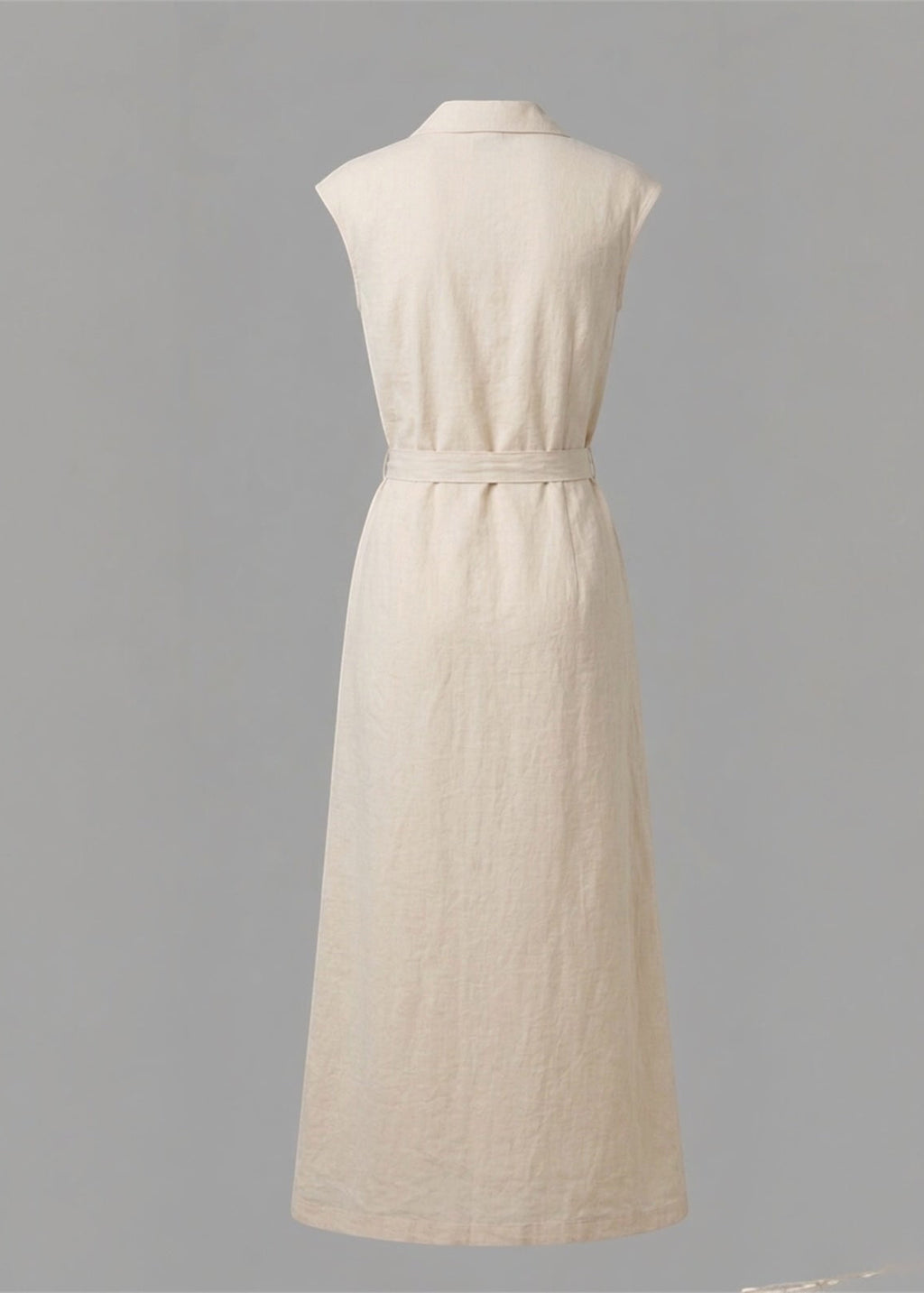 Beige sleeveless dress on a gray background