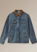 A blue denim utility jacket with a contrasting brown corduroy collar, laid flat against a solid beige background.