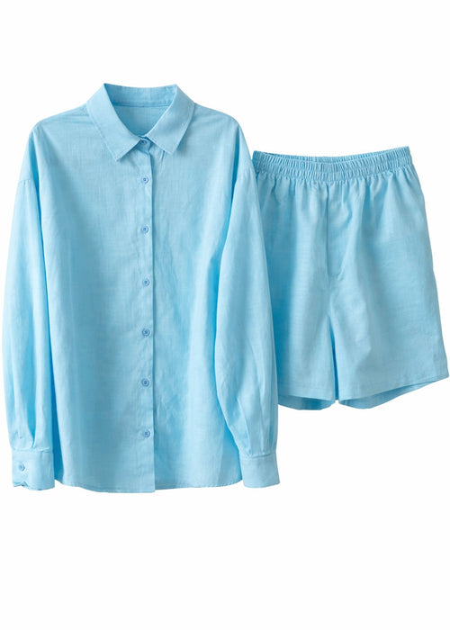Light blue shirt and shorts set on a white background