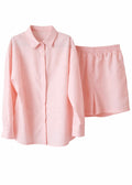 Pink shirt and shorts set on a white background